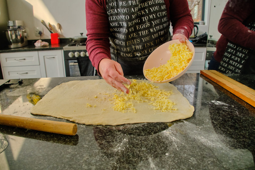 Add butter to the rectangle of dough. 